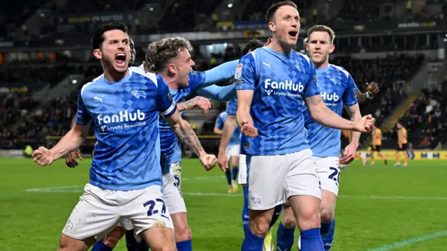 Craig Forsyth celebrates in front of the Derby fans