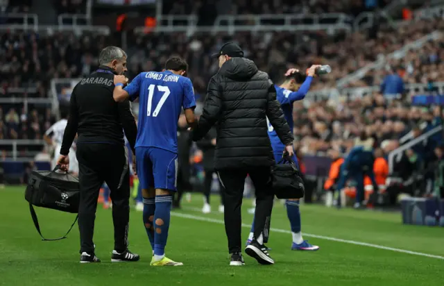 Camilo Duran of Qarabag leaves the pitch after sustaining an injury