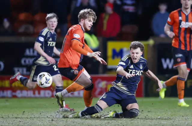 Aberdeen's Dennis Geiger (R) and Dundee United's Luca Stephenson (L) in action during a William Hill Premiership match between Dundee United and Aberdeen at the CalForth Construction Arena at Tannadice Park,