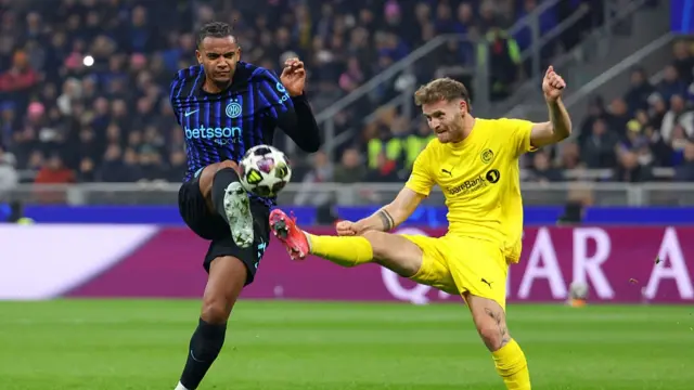 Manuel Akanji of FC Internazionale Milano and Ole Didrik Blomberg of Bodo/Glimt battle for possession during the UEFA Champions League 2025/26 League Knockout Play-off Second Leg match between FC Internazionale Milano and FK Bodo/Glimt