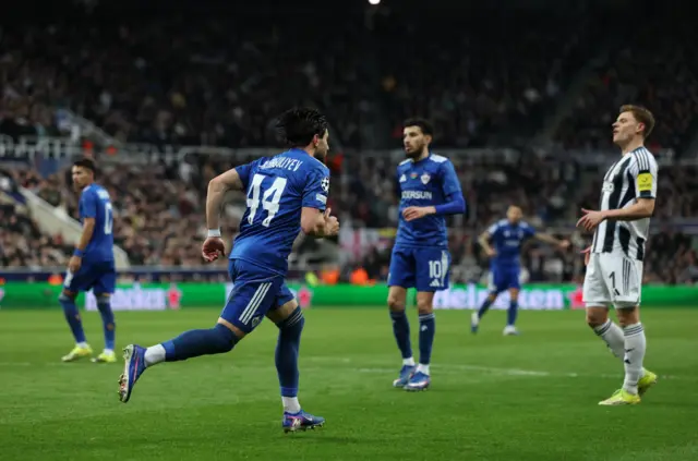Elvin Cafarguiliyev (L) of Qarabag celebrates scoring the 2-3 goal