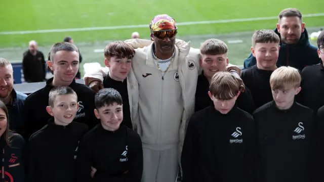 Snoop Dogg with the mascots at the Swansea.com Stadium