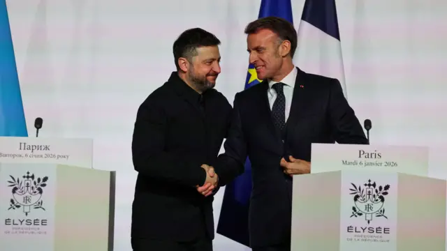 France's President Emmanuel Macron and Ukraine's President Volodymyr Zelenskiy shake hands