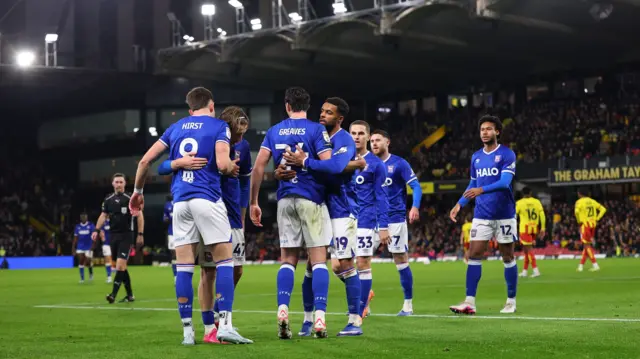 George Hirst celebrates with Ipswich team-mates at Watford