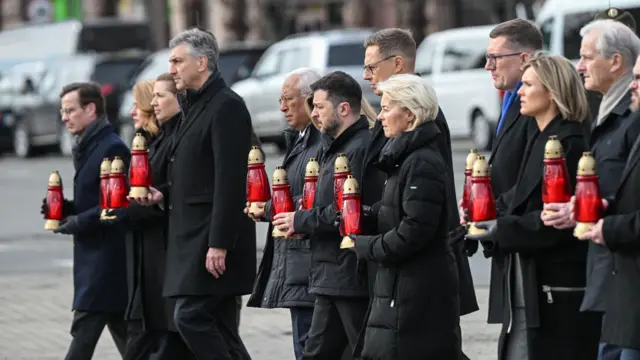 Ukraine's President Volodymyr Zelensky (C-L), Estonia's Prime Minister Kristen Michal (C) and European Commission President Ursula von der Leyen (C-R) along with EU leaders attend a ceremony at the memorial to the fallen Ukrainian soldiers on Independence Square in Kyiv, Ukraine, 24 February 2026.