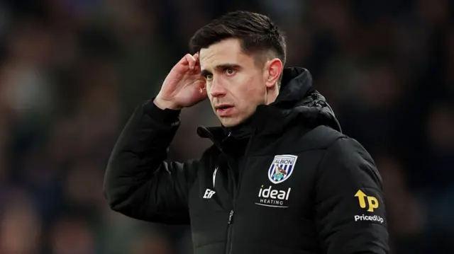 Former West Brom head coach Eric Ramsay scratching his head