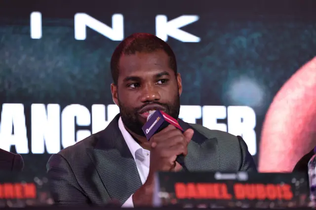 Daniel Dubois speaks on the microphone
