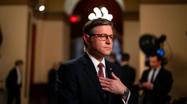 Mike Johnson holds his hand against his chest