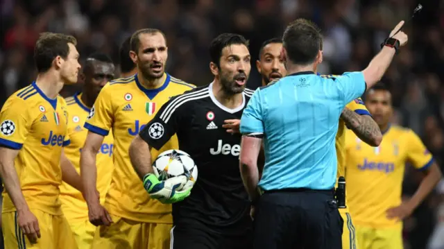 Gianluigi Buffon protests the referee's decision