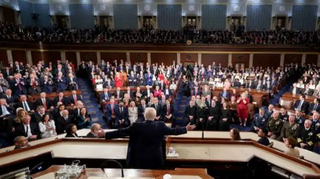 US President Donald Trump speaks during a State of the Union address in the House Chamber