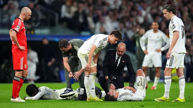Eduardo Camavinga and Raul Ascencio injured on the floor