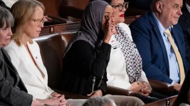House Democrat Ilhan Omar heckles the president during his speech