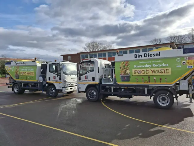 Two bin wagons parked facing each other, one named Oprah Binfrey and the other Bin Diesel