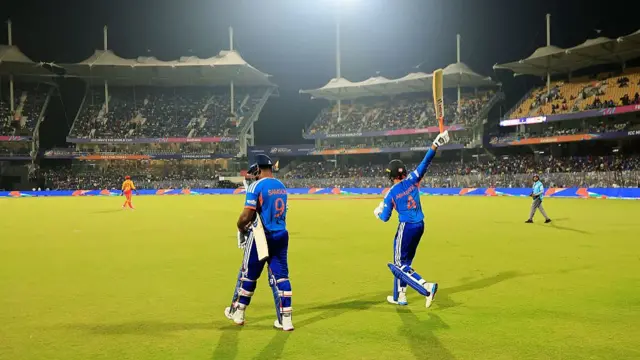Sanju Samson of India and Abhishek Sharma of India walk out to bat
