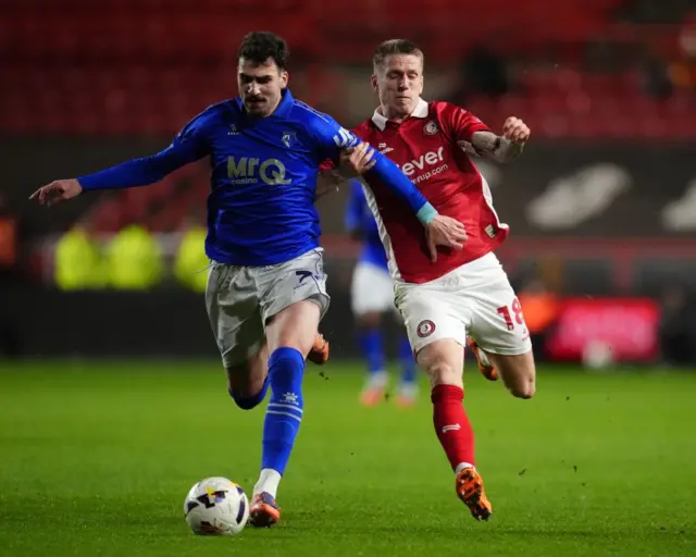 Watford's Saba Goglichidze (left) and Bristol City's Emil Riis Jakobsen (right)
