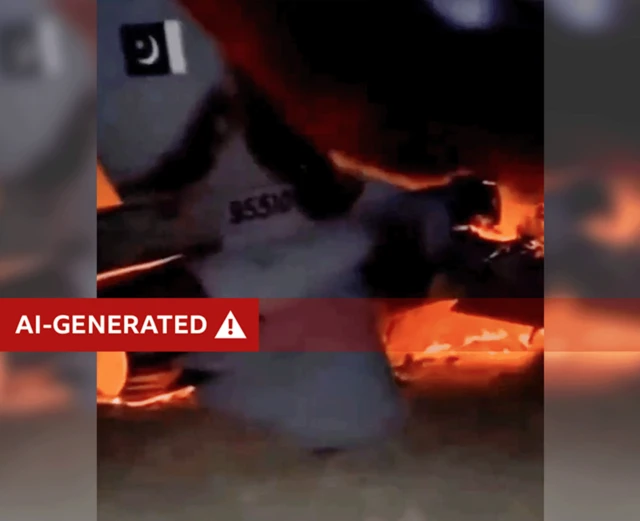 Screen grab from video shows tail of jet engulfed in flames