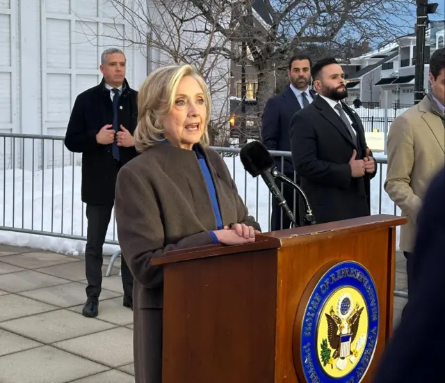 Hillary Clinton behind a lectern