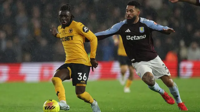 Wolverhampton Wanderers' Portuguese-born English striker #36 Mateus Mane (L) vies with Aston Villa's Brazilian midfielder #21 Douglas Luiz (R) during the English Premier League football match between Wolverhampton Wanderers and Aston Villa at the Molineux stadium in Wolverhampton,