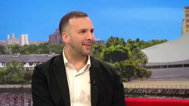 Polanski sitting on BBC Breakfast sofa