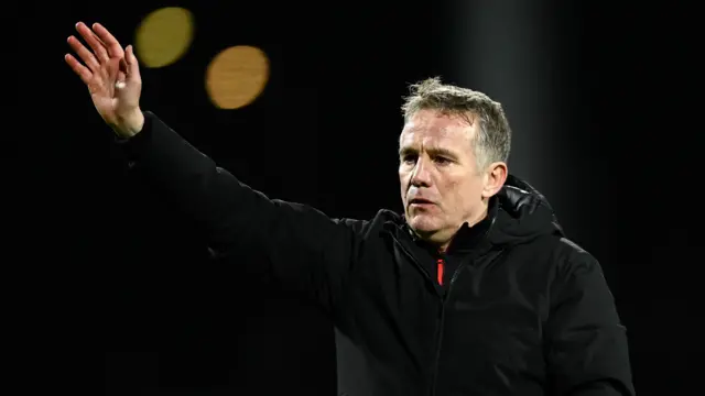 Phil Parkinson waves to Wrexham fans