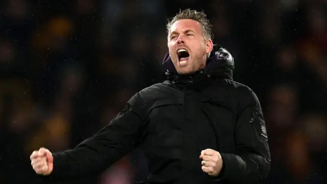 Rob Edwards, Manager of Wolverhampton Wanderers, celebrates following victory in the Premier League match between Wolverhampton Wanderers and Aston Villa