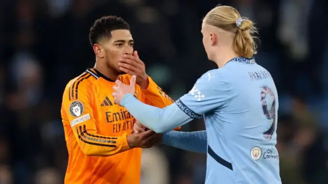 Erling Haaland of Manchester City and Jude Bellingham of Real Madrid interact
