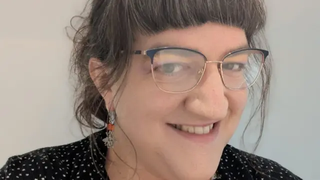 Josie Gordon pictured wearing glasses. She has brown hair and a fringe.