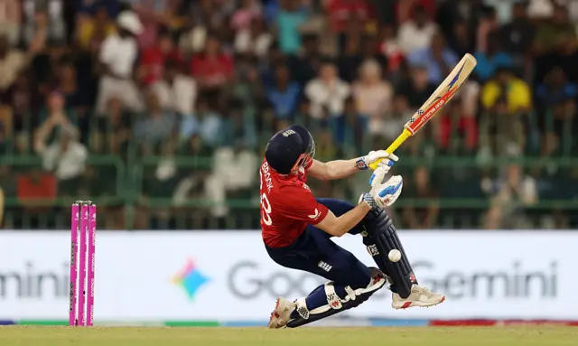 Harry Brook falls over playing an attempted scoop