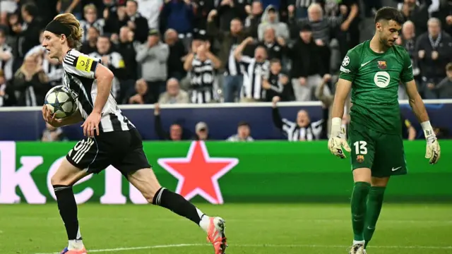 Anthony Gordon celebrates after scoring against Barcelona