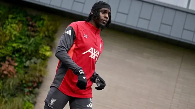 Jeremie Frimpong of Liverpool looks on