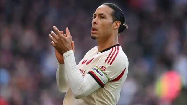 Virgil van Dijk of Liverpool applauds his team's supporters
