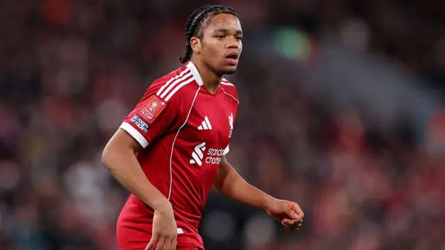 Rio Ngumoha of Liverpool looks on