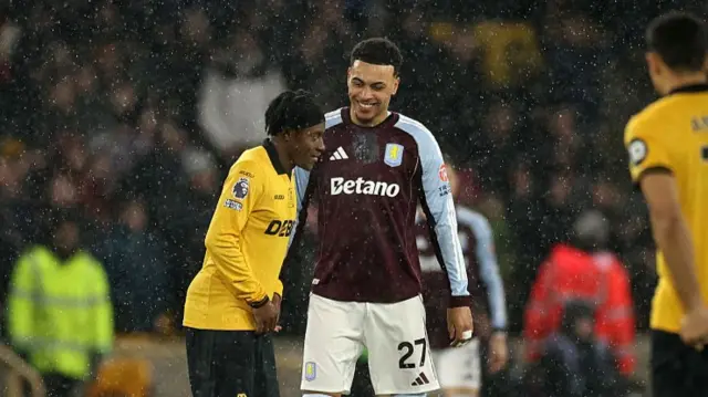 Jean-Ricner Bellegarde of Wolverhampton Wanderers and Morgan Rogers of Aston Villa interact prior to the Premier League match between Wolverhampton Wanderers and Aston Villa