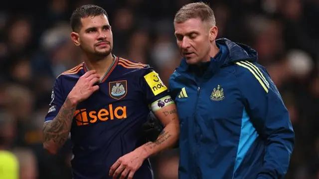 Bruno Guimaraes of Newcastle United is taken off injured