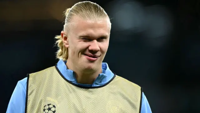 Manchester City's Norwegian striker #09 Erling Haaland winks during the warm up