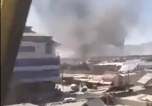 Columns of smoke rise from a Taliban military base in the Urgun district of Paktia province