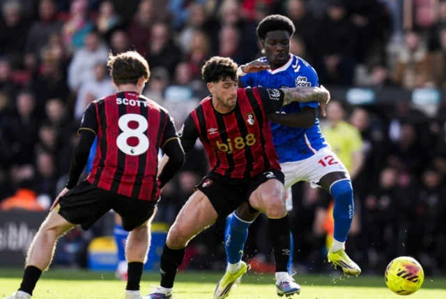 Bournemouth's Marcos Senesi and Sunderland's Eliezer Mayenda (right) battle for the ball