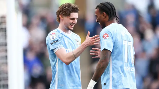 Haji Wright celebrates with Jack Rudoni