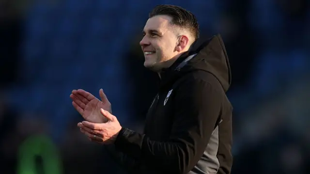 Oxford boss Matt Bloomfield claps the home fans