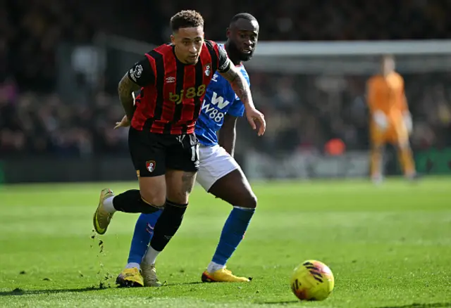 Lutsharel Geertruida puts pressure on Bournemouth's English midfielder Marcus Tavernier