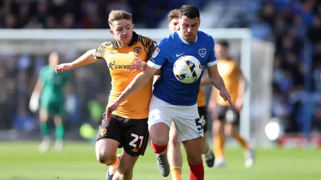 Hull's Joe Gelhardt battles with Regan Poole of Portsmouth