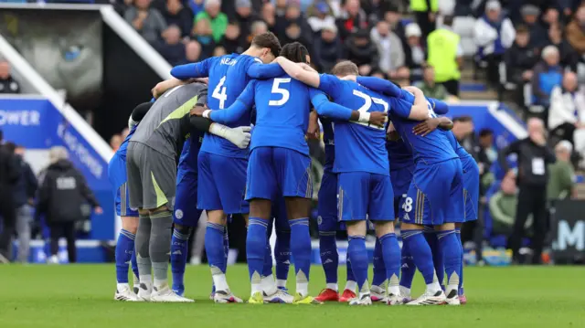 Leicester players form a huddle just before kick-off