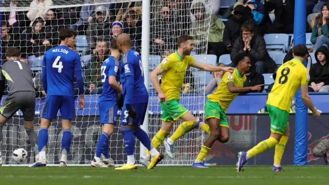 Norwich goalscorer Ali Ahmed runs off to celebrate