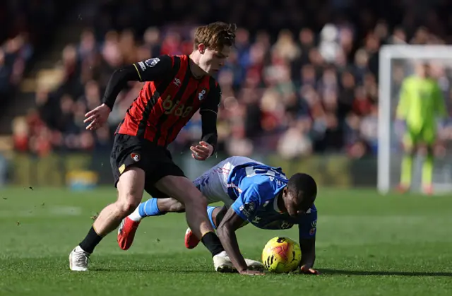 Alex Scott of AFC Bournemouth challenges Habib Diarra