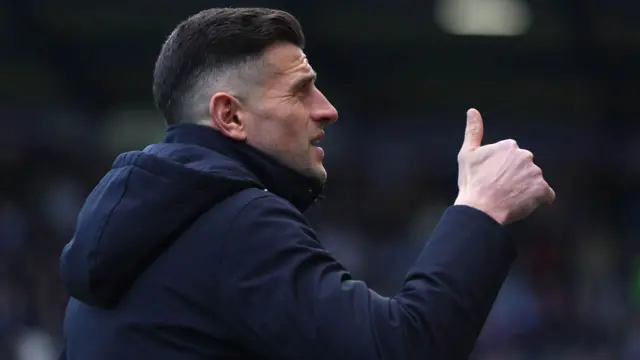 Portsmouth boss John Mousinho gives a thumbs up