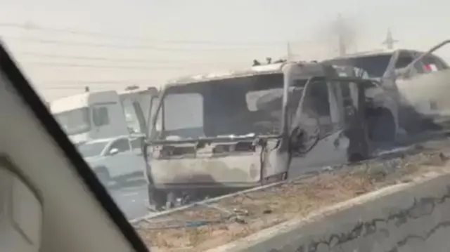 Image of burned-out truck on the motorway in Kuwait following reports of a strike earlier today