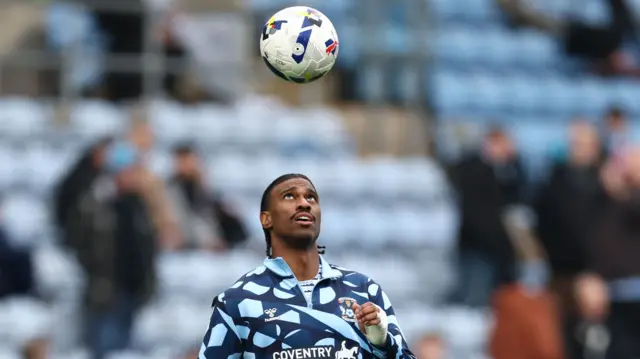 Coventry striker Haji Wright warms up