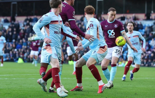 Burnley's Ashley Barnes appears to handle the ball