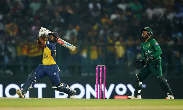 Charith Asalanka of Sri Lanka plays a shot as Usman Khan of Pakistan keeps during the ICC Men's T20 World Cup India & Sri Lanka 2026 Super 8 match between Sri Lanka and Pakistan at Pallekele Cricket Stadium