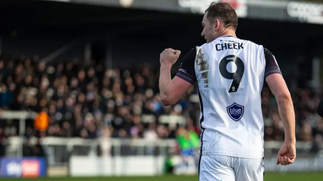 Michael Cheek celebrates
